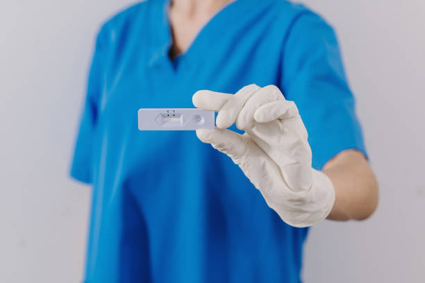 istock COVID-19 virus disease diagnostic,doctor holding Coronavirus test cassette,rapid strep  kit,quick antigen detection testing 1424150430