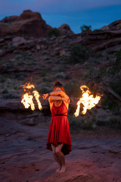 istock Fire dancer performing at dusk in Moab Park, USA 1424160866