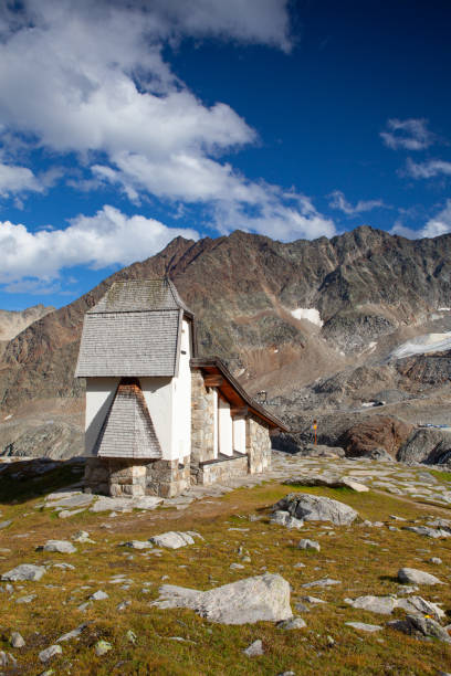 The mountain church close to Tiefenbach glacier, Austria The mountain church close to Tiefenbach glacier, Austria. The mountain church not far from the Rettenbachferner was built in a grandiose high alpine landscape, Austria rettenbach glacier stock pictures, royalty-free photos & images