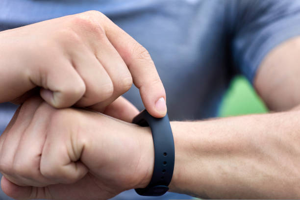 istock on a man's hand modern smart watch with black strap 1424164384