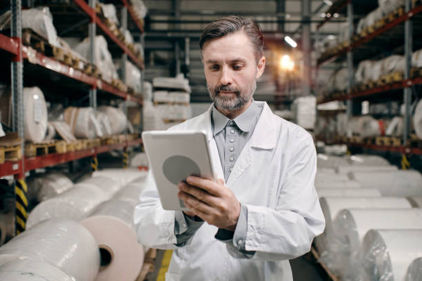 istock Man working on factory with tablet 1424164451