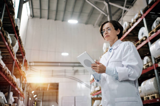 istock Female worker using tablet at the factory 1424164476