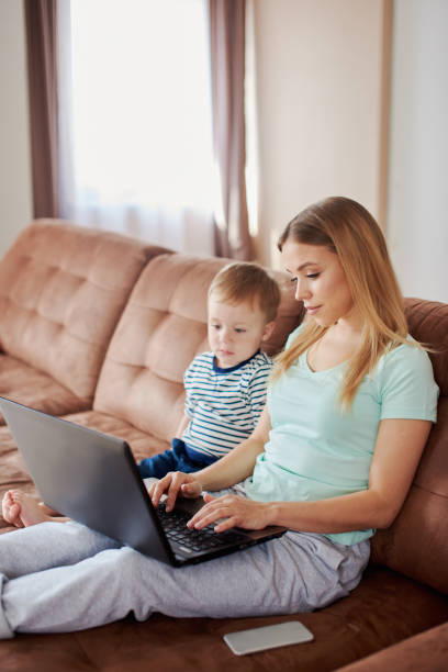 istock Mother and son using laptop together 1424165861