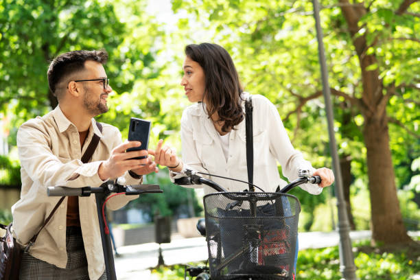 istock Happy couple with bicycle in the park. 1424167535