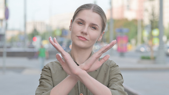 Portrait of Rejecting Young Woman Doing No Gesture Outdoor