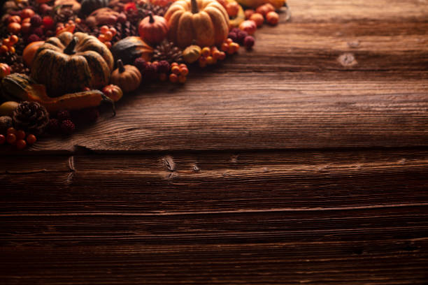 istock Autumn composition on a rustic wooden background. 1424170753