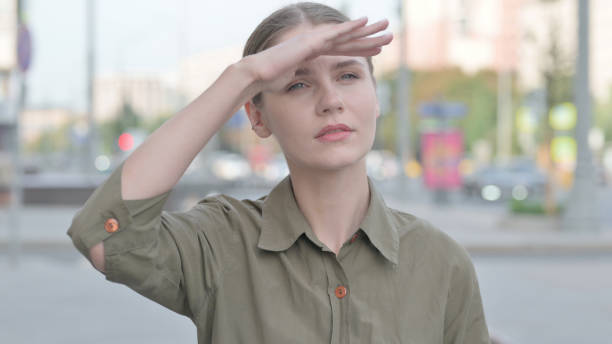 A healthcare worker showing the signs of fatigue from working long hours combatting communicable disease in a hospital.
