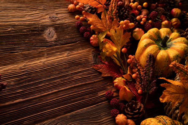 istock Autumn composition on a rustic wooden background. 1424171696