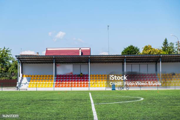 Many Yellow And Red Seats In A Football Stadium Championship Football Places For Spectators Stock Photo - Download Image Now