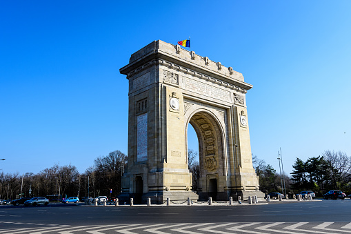Bucharest, Romania, 3 April 2021: Arcul de Triumf (The Arch Of Triumph) is a triumphal arch and landmark, located in the Northern part of the city on Kiseleff Road near King Michael I (Herastrau) Park