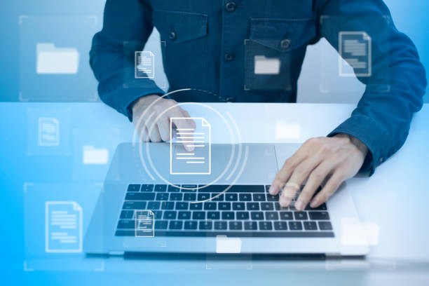 istock Document Management System DMS Online Database and automated processes to manage files in an organization effectively with ERP, enterprise business technology. businessman touch virtual screen. 1424178348