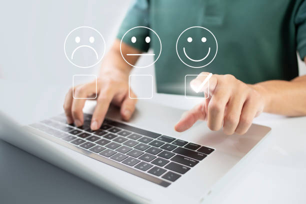 istock Satisfaction and customer service survey concept, business people using  laptop. to answer the questionnaire And the satisfaction rating, the satisfaction rating with the smiley face icon. 1424178355