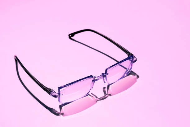 istock Black framed eyeglasses on pink background 1424182270