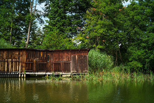 Old weathered wooden boathouses, Havel River, Brandenburg State