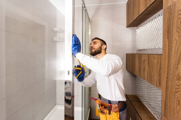 istock Professional plumber with plunger and instruments near sink. 1424194632