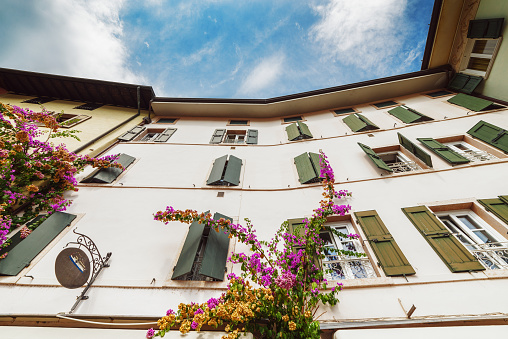 Lovely house facade with bougainvillea flowers in Limone sul Garda. Limone sul Garda is a town and comune in the province of Brescia, in Lombardy (northern Italy), at the western bank of Lake Garda.