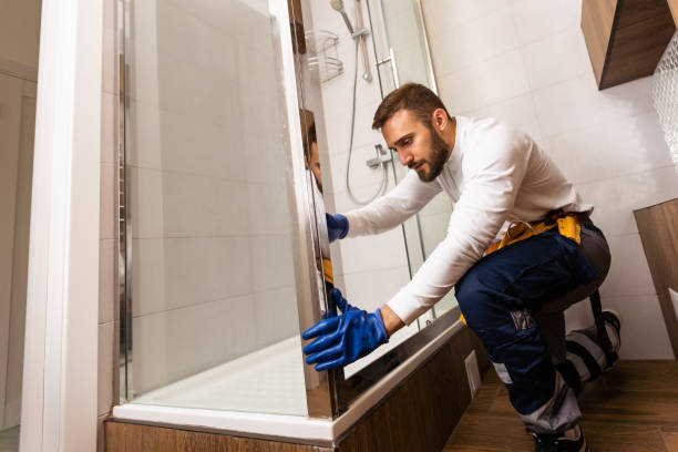 istock Professional plumber with plunger and instruments near sink. 1424197363