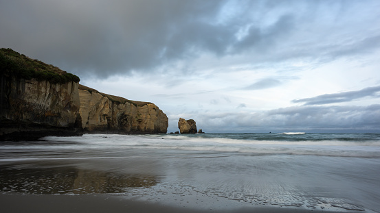 Stormy clouds gathering at Tunnel Beach, Dunedin.