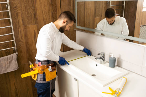 istock plumber service. wash basin installation 1424202197