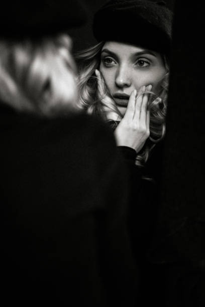 istock Beautiful woman and her reflection 1424204879