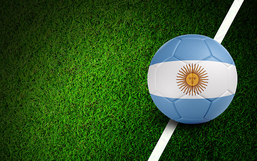 Argentinian flag on a soccer ball over soccer field. Easy to crop for all your social media and design need.