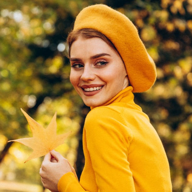 istock Beautiful woman enjoying autumn 1424207976