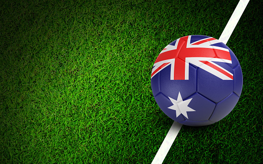 Australian flag on a soccer ball over soccer field. Easy to crop for all your social media and design need.