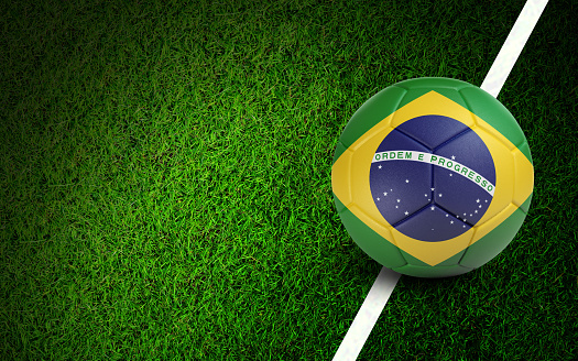 Brazilian flag on a soccer ball over soccer field. Easy to crop for all your social media and design need.
