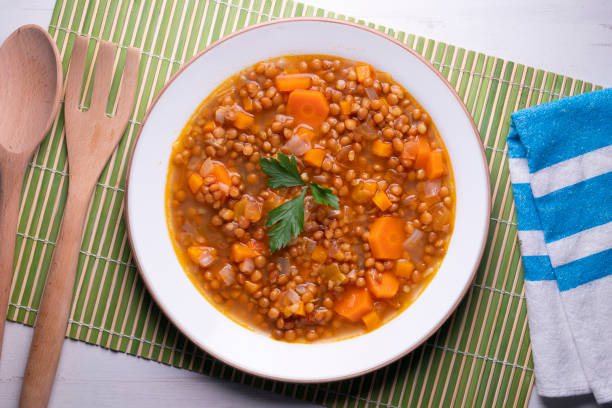 istock Lentils with carrots. Traditional northern spanish tapa. 1424213603