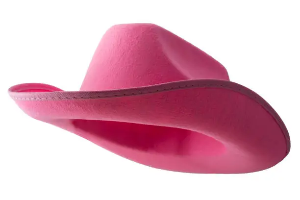 Pink cowboy hat isolated on white background with clipping path cutout concept for feminine western attire, gentle femininity, American culture  and fashionable cowgirl clothing