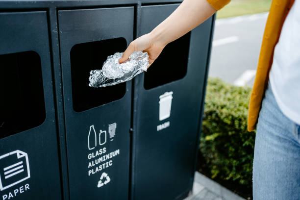 Young Woman Recycling Aluminum Foil