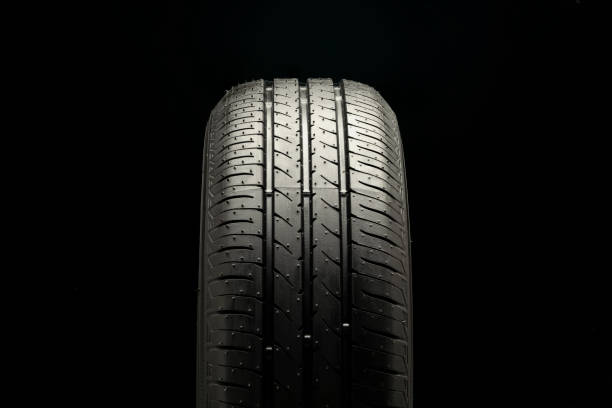 istock New summer tire tread on black background 1424219912