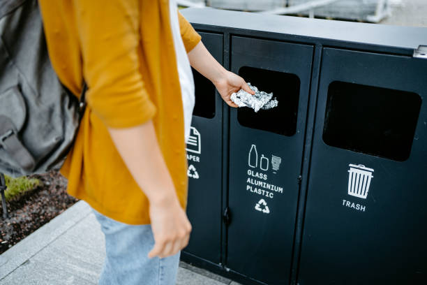 istock Young Woman Recycling Aluminum Foil 1424220126