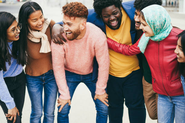 istock Young multiracial people having fun outdoor laughing together - Diversity concept 1424222544
