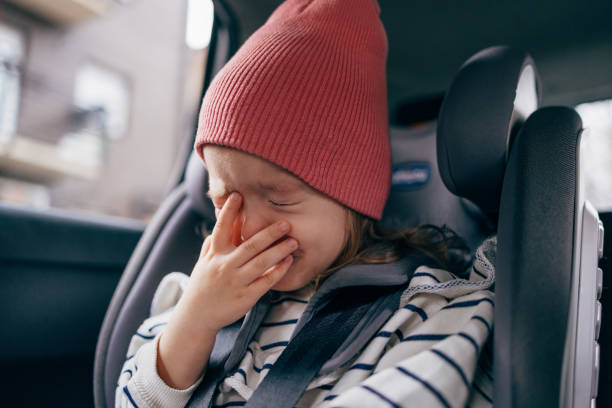 istock An Anonymous Little Girl Crying While Traveling by Car 1424226117