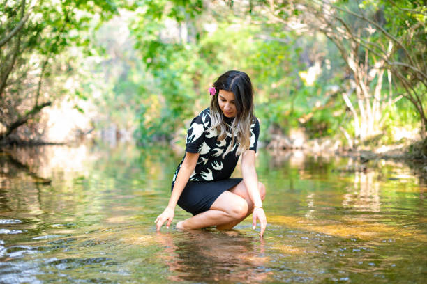 Beautiful Woman Poses on Untouched River