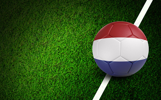 Dutch flag on a soccer ball over soccer field. Easy to crop for all your social media and design need.