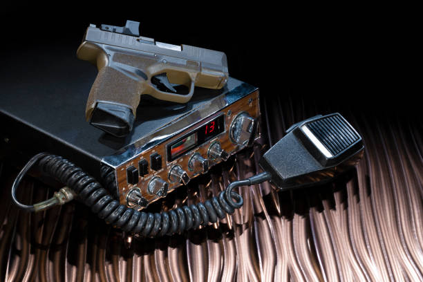 istock Two way radio and handgun 1424229324