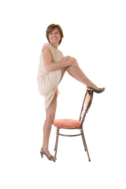 istock slim woman with a chair 1424230657