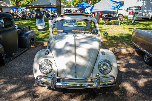 Falcon Heights, MN - June 18, 2022: High perspective front view of a 1963 Volkswagen Beetle Deluxe Ragtop Sunroof at a local car show.