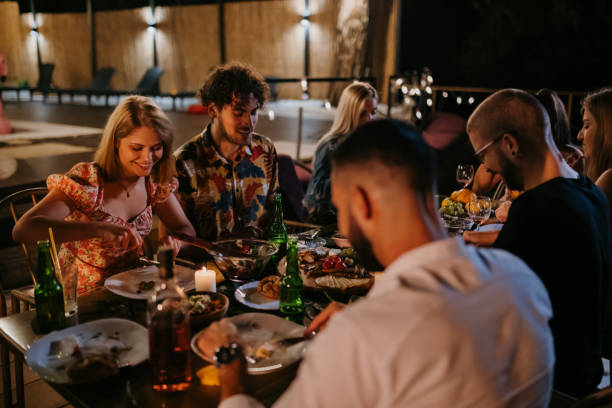 istock A small group of people are having a crazy time during dinner 1424235044