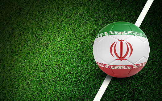 Iranian flag on a soccer ball over soccer field. Easy to crop for all your social media and design need.