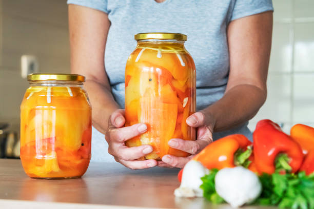 Senior woman preparing vegetable from her garden for winter.