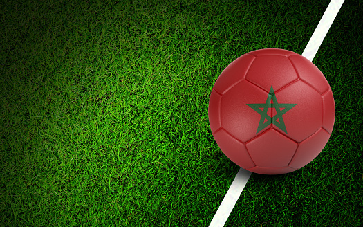 Moroccan flag on a soccer ball over soccer field. Easy to crop for all your social media and design need.