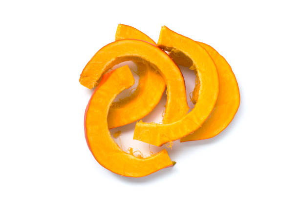 Pumpkin cut into pieces. White background