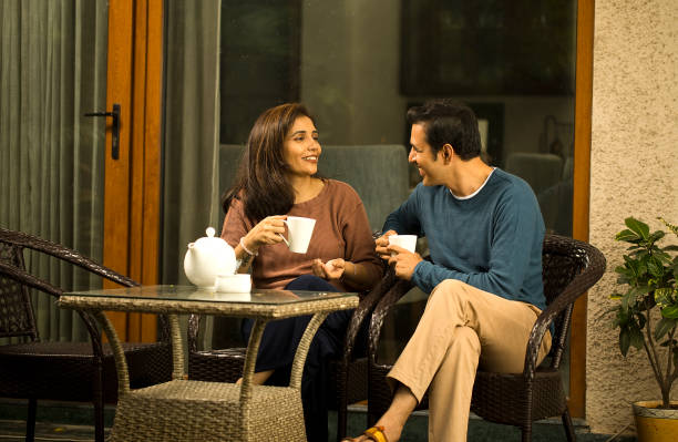 istock Couple having coffee outdoors 1424242491