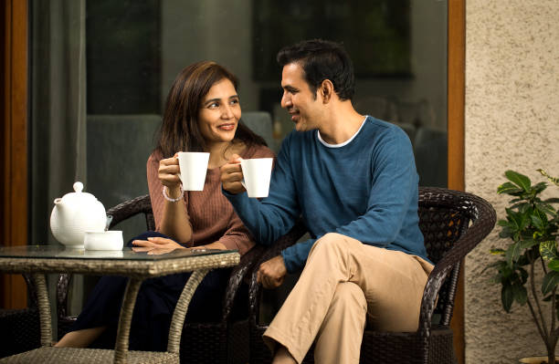 istock Couple having coffee outdoors 1424242795