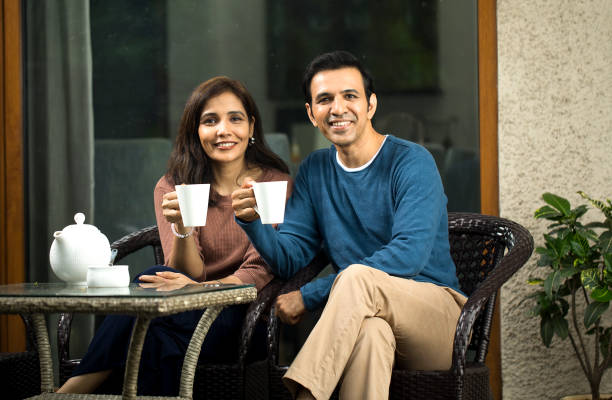 istock Couple having coffee outdoors 1424242877