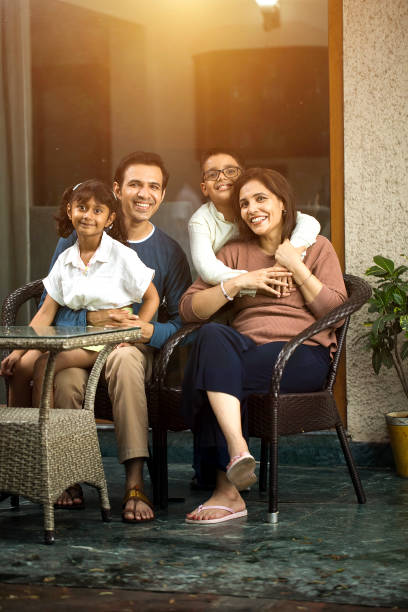 istock Happy family spending leisure time at terrace 1424244449