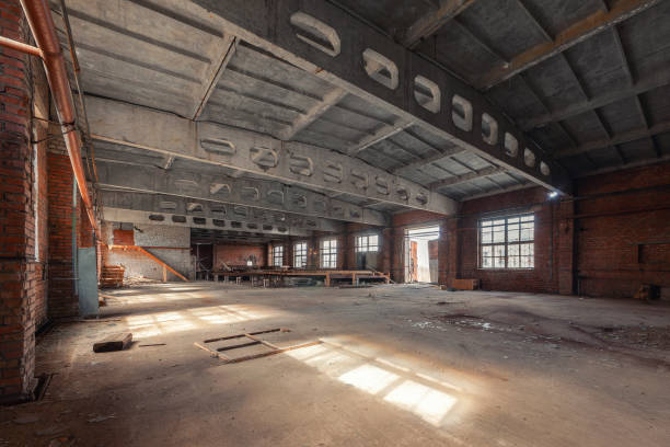 istock Abandoned industrial building with concrete trusses brick walls 1424245082